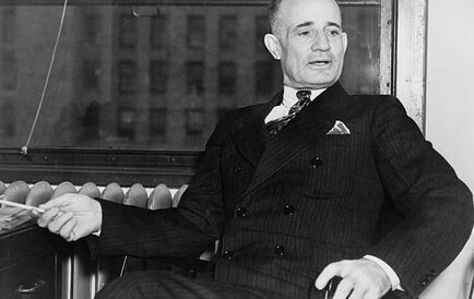 Napoleon Hill seated in chair