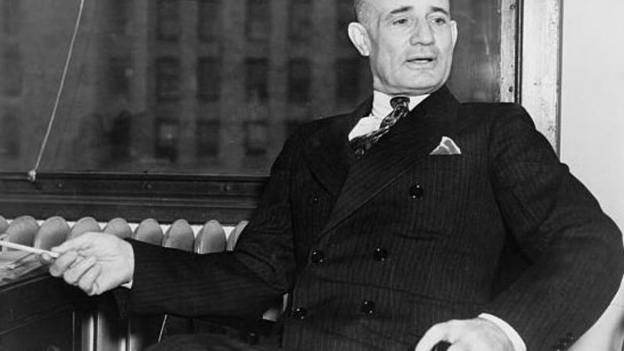 Napoleon Hill seated in chair